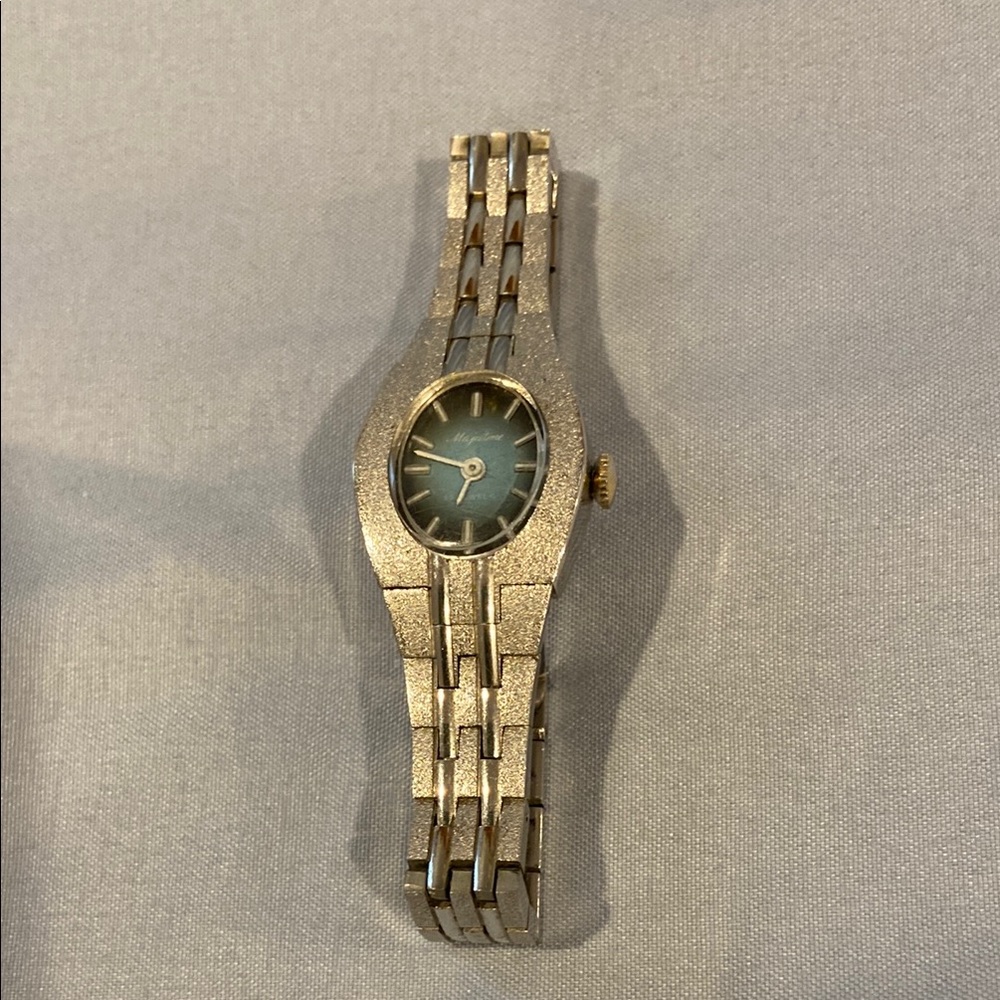 Elegant silver metal, blue face, women’s mechanical wristwatch.